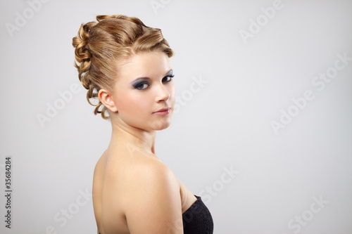 Modern hairstyle. On a gray background