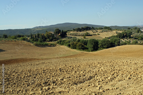 land of ploughed fields in the hills of Tuscany in summer