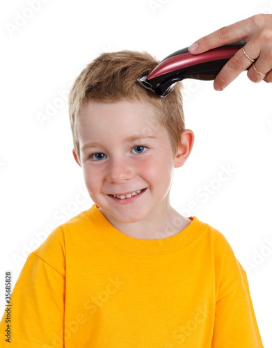 Принти на полотні Smiling boy getting haircut