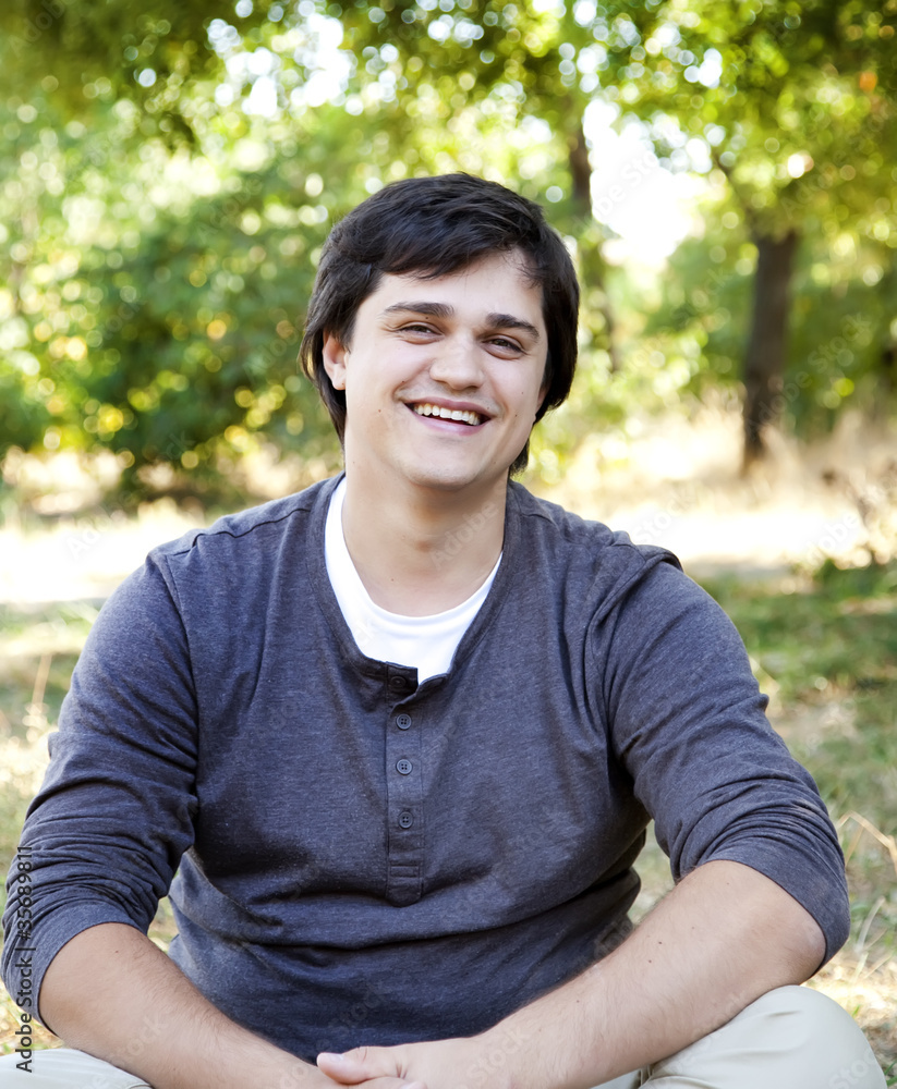 Portrait of brunette men at outdoor.