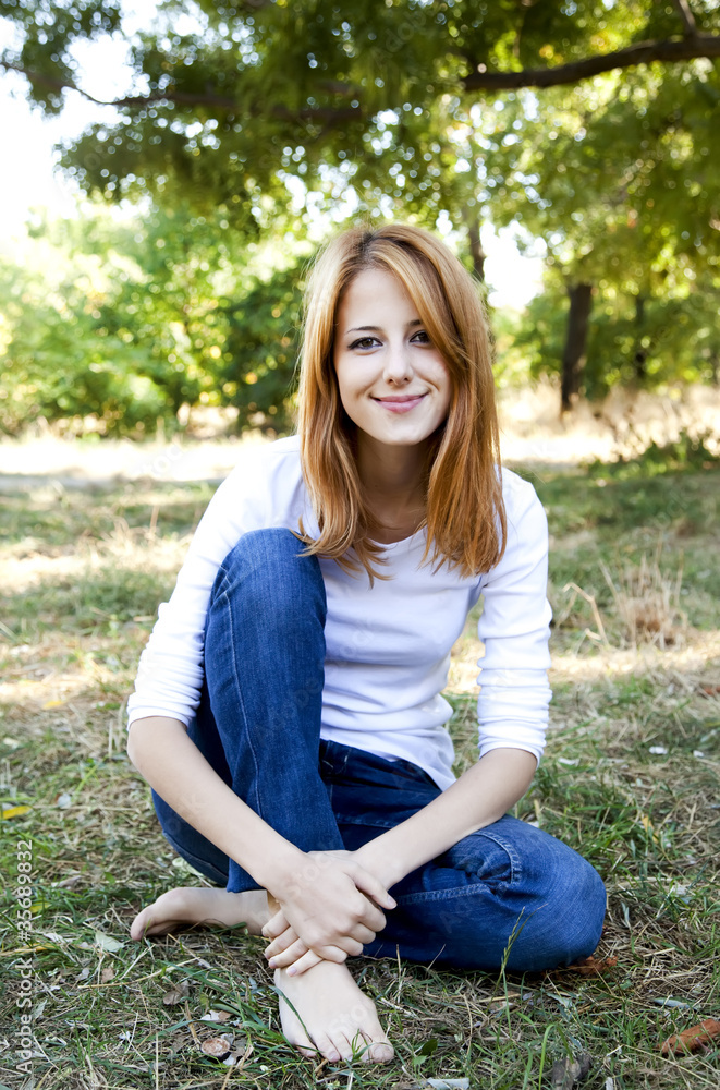Obraz premium Portrait redhead girl at outdoor.