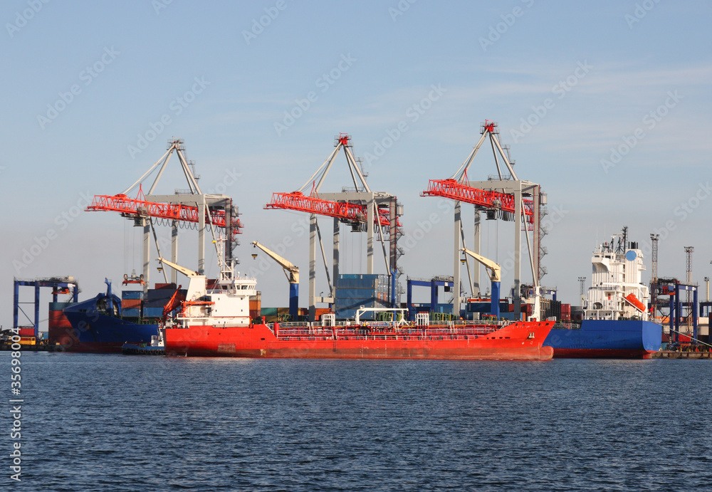 seaport with cranes and cargo ships