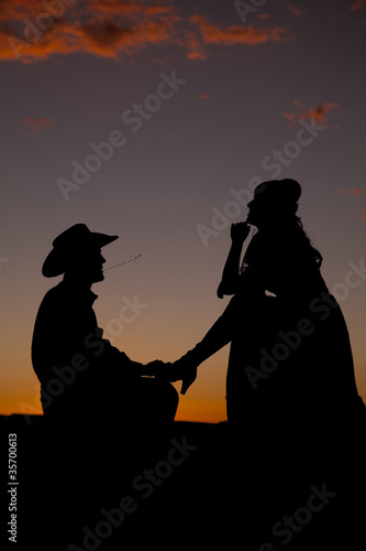Cowboy couple silhouette her think