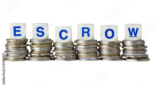 Konstfotografi Stacks of coins with the word ESCROW isolated on white