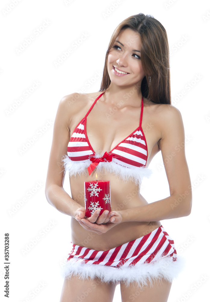 Sexy santa helper girl in red stripped bikini Stock Photo | Adobe Stock