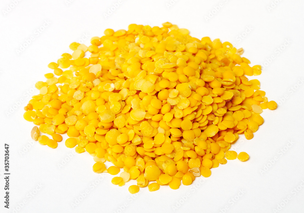 Yellow lentils isolated on white background.Macro shot Yellow lentils isolated on white background.Macro shot