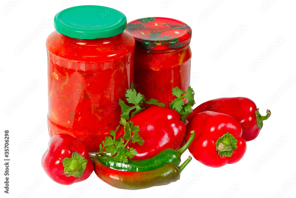 Home canned vegetables in glass jars and peppers Home canned vegetables in glass jars and peppers