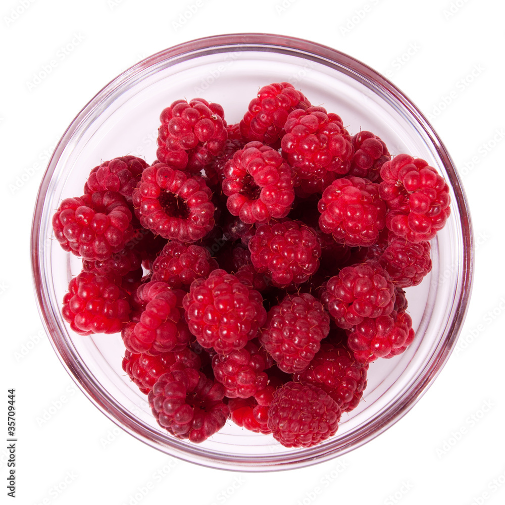 Red raspberries in a glass bowl Red raspberries in a glass bowl