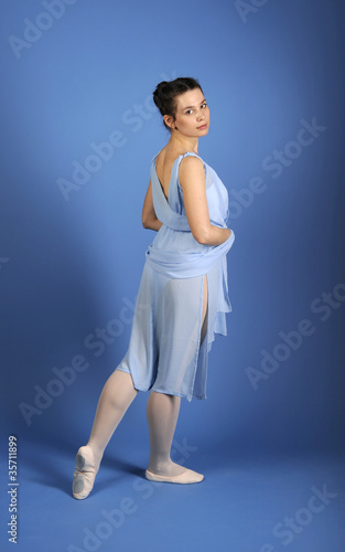 Ballet dancer posing in blue dress