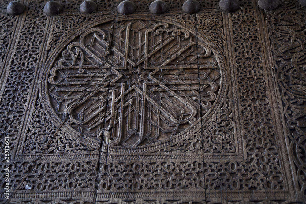 Uzbekistan, an ancient wooden door decorated