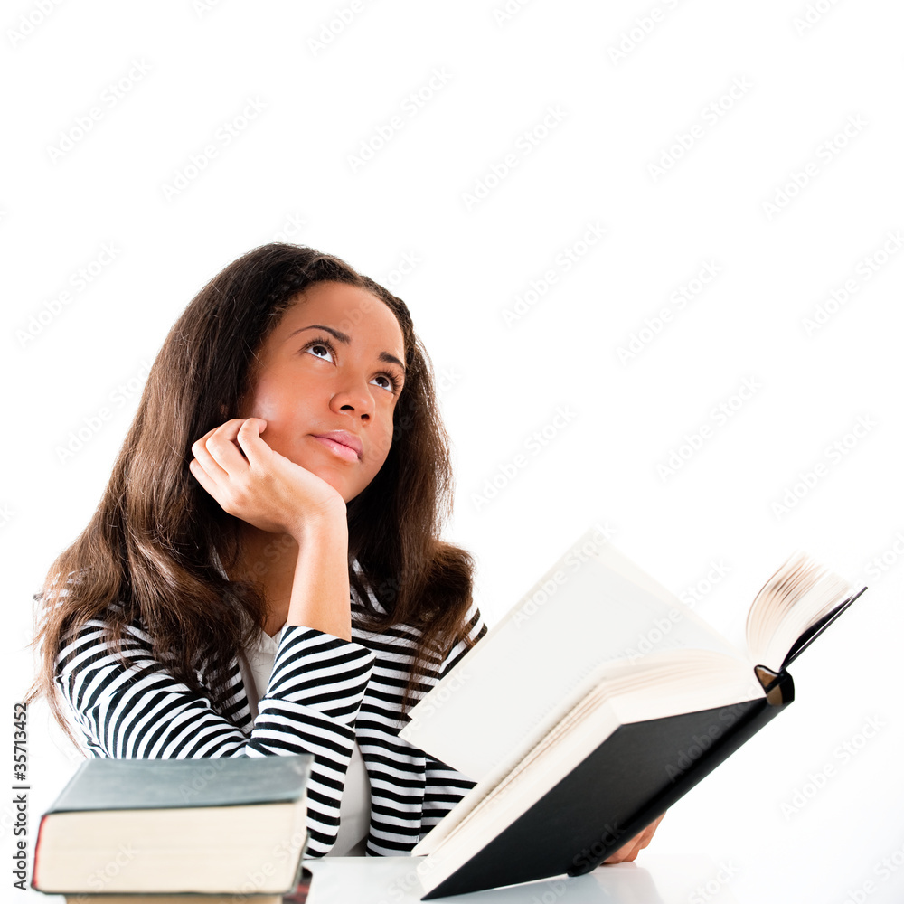 Smiling student with open book thinking Smiling student with open book thinking