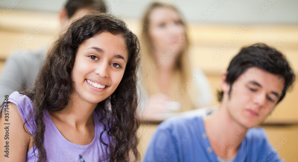 Smiling student in a amphitheater Smiling student in a amphitheater