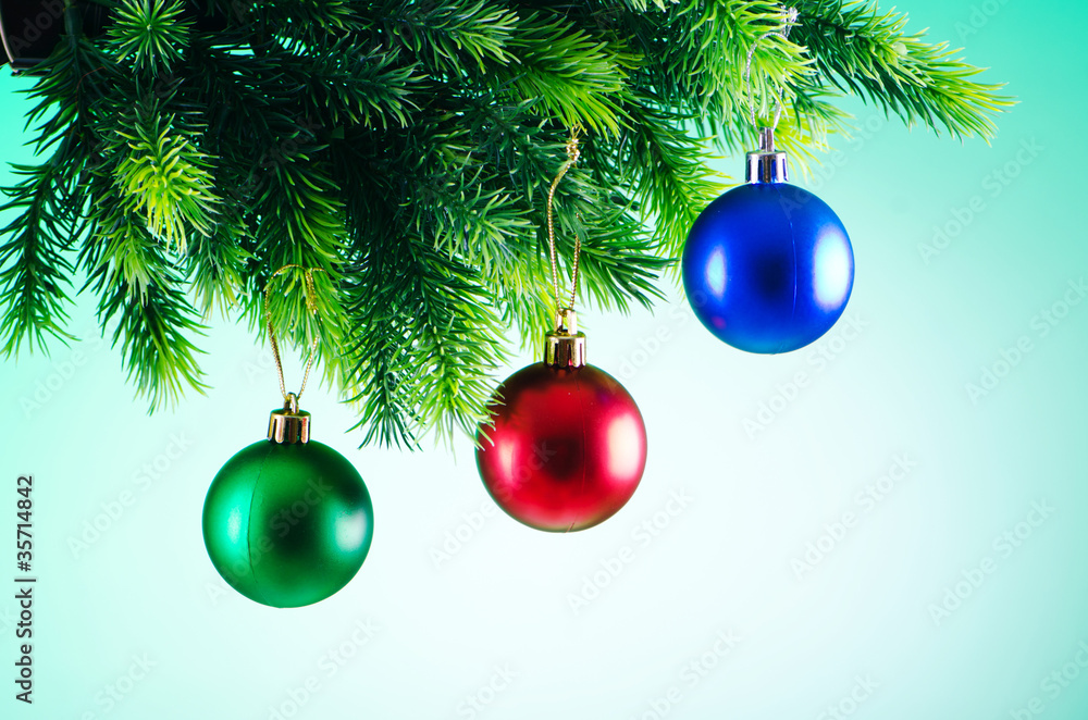 Baubles on christmas tree in celebration concept