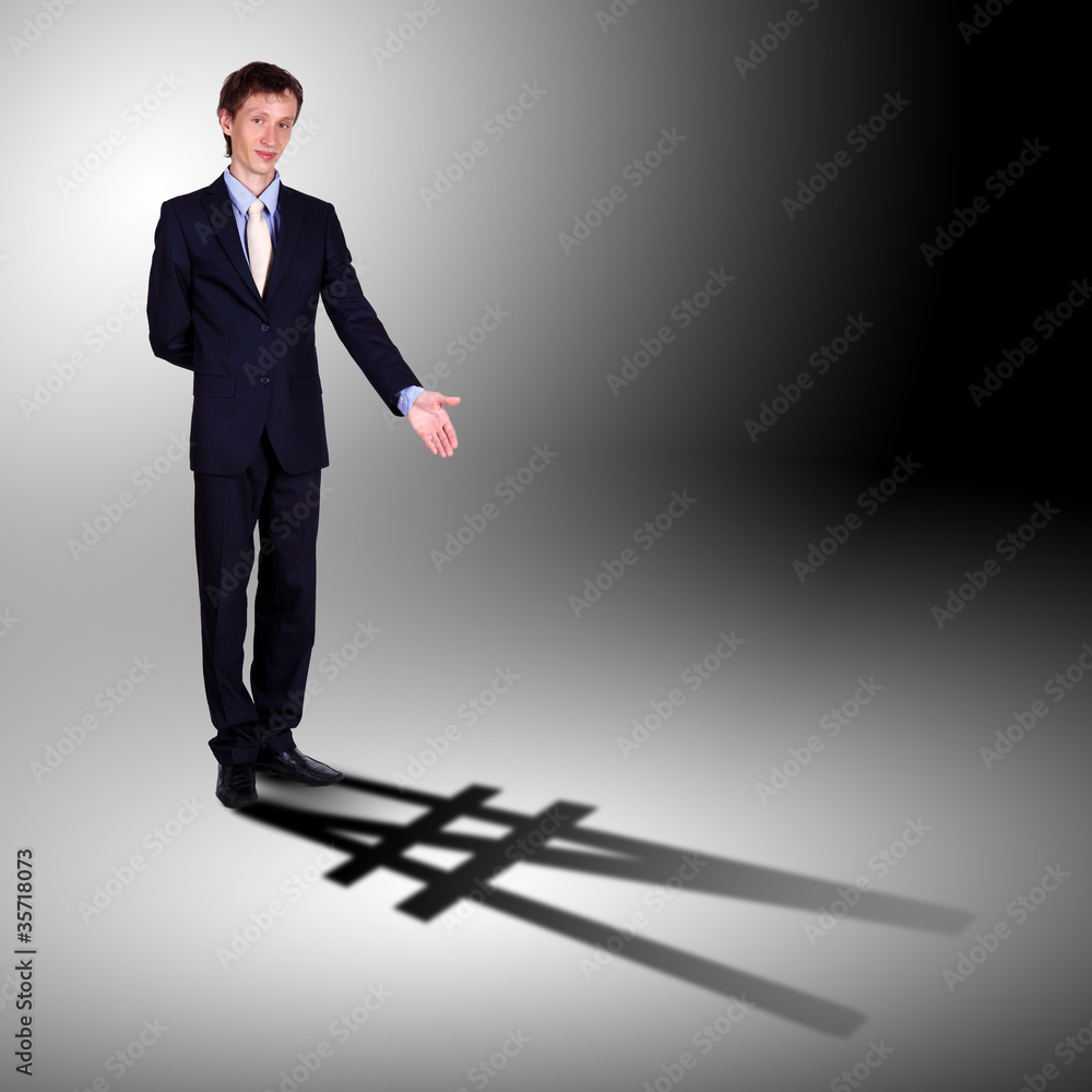 Businessman with shadow as a currency symbol Businessman with shadow as a currency symbol