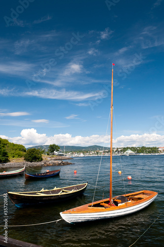 A wooden boats tied to the shore  Oslo. Norway.