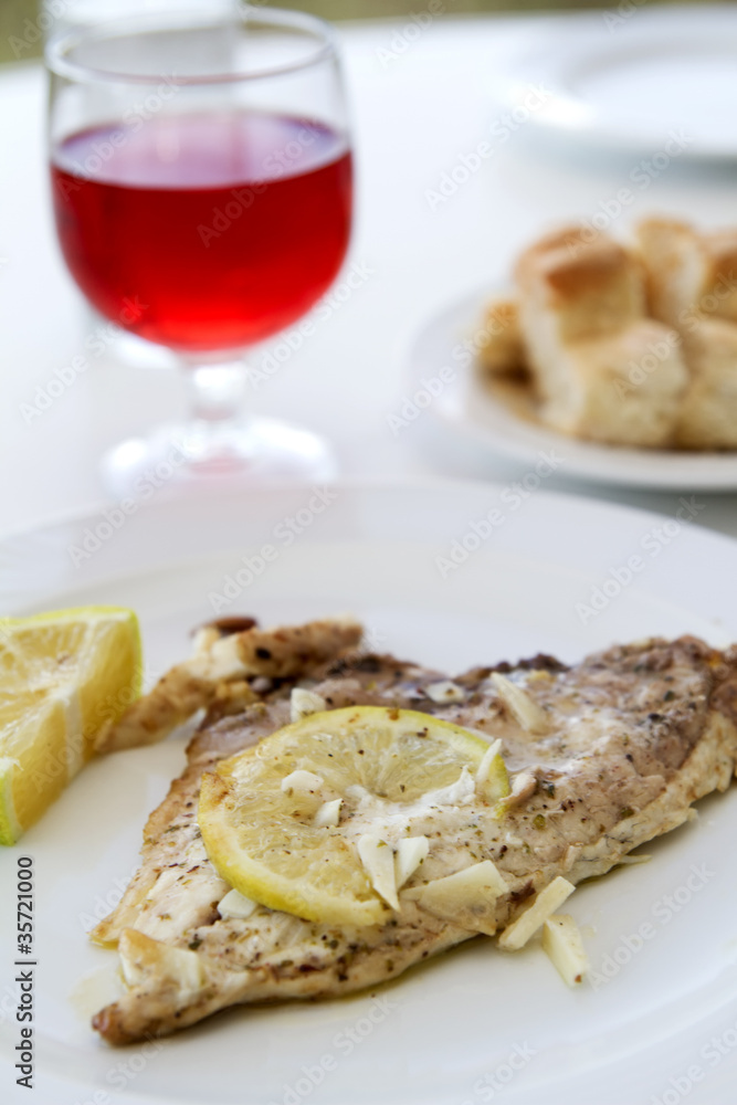 Gilt-head bream with wine and baguette Gilt-head bream with wine and baguette