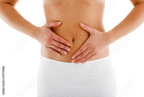 Woman massaging pain stomach isolated on white