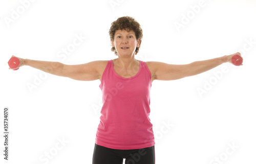 senior middle age woman exercising with dumbbells