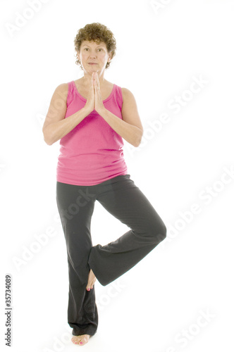 middle age senior woman fitness yoga pose