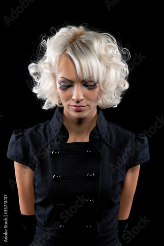 fashion portrait of beautiful girl with make up over black