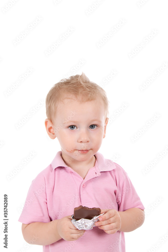 Little boy holding chocolate bar over white background Little boy holding chocolate bar over white background