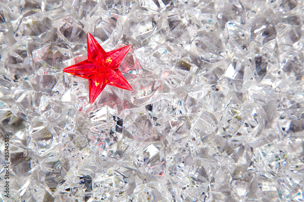 christmas red glass star on cold winter ice background christmas red glass star on cold winter ice background