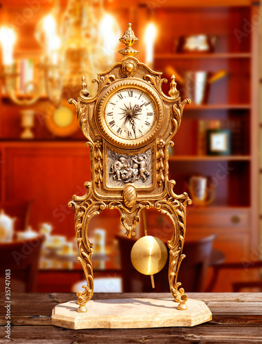 ancient vintage brass pendulum clock