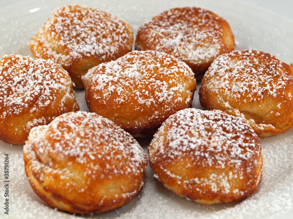 A Plate of Freshly Made Aebelskivers with Powdered Sugar