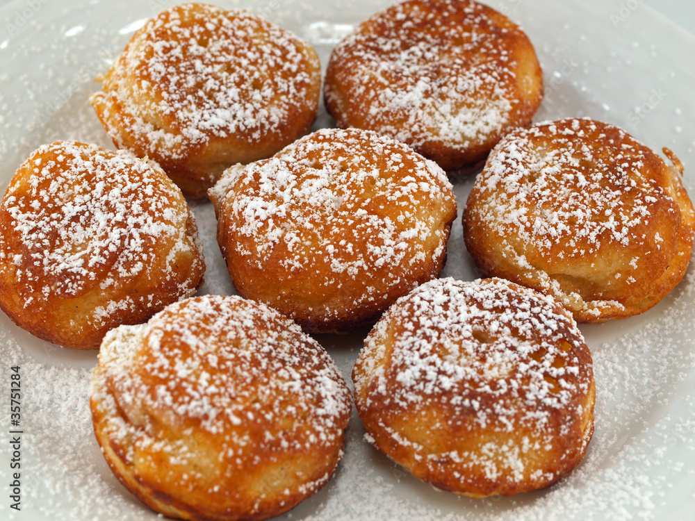 A Plate of Freshly Made Aebelskivers with Powdered Sugar