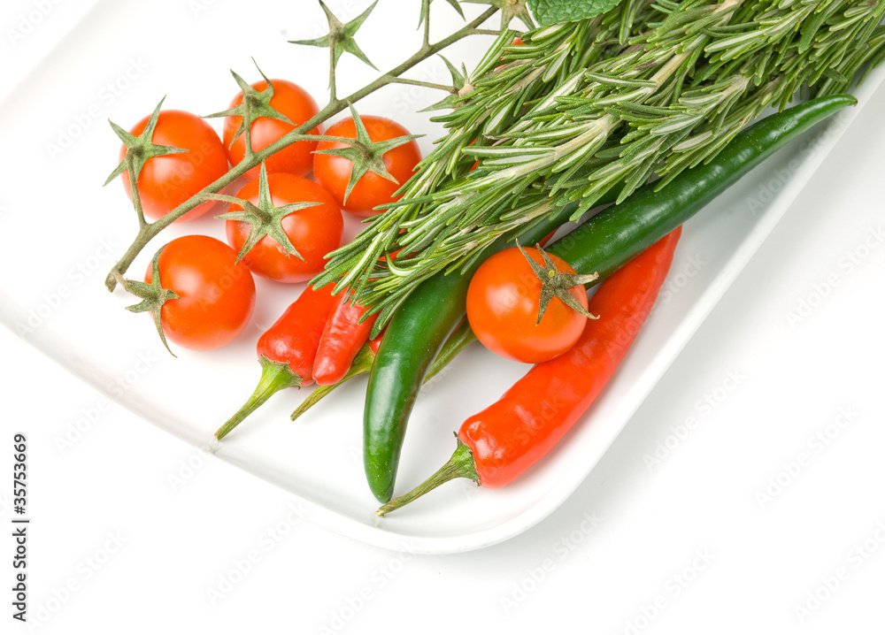 fresh vegetables in plate isolated on white background