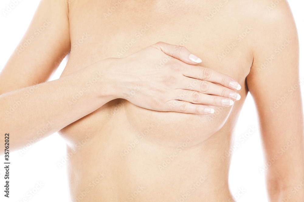 Breast cancer, woman holding her breast