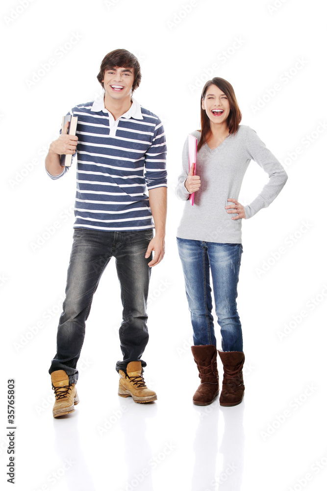 Young woman and man standing with books Young woman and man standing with books