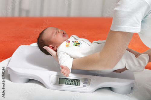 baby boy on weight scale