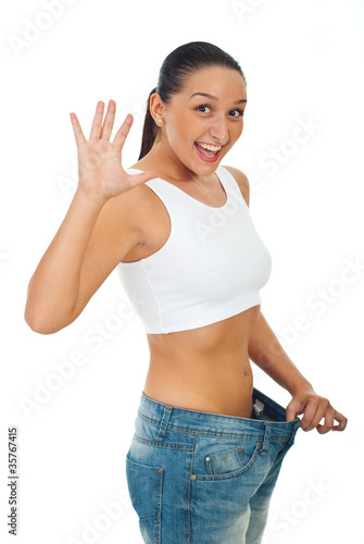 Extremely happy slim woman showing progress