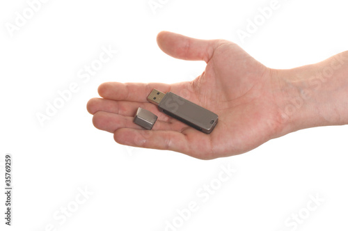well shaped hand with an USB flash isolated over white