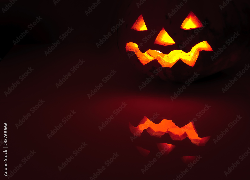 Glowing pumpkin with a candle inside Glowing pumpkin with a candle inside