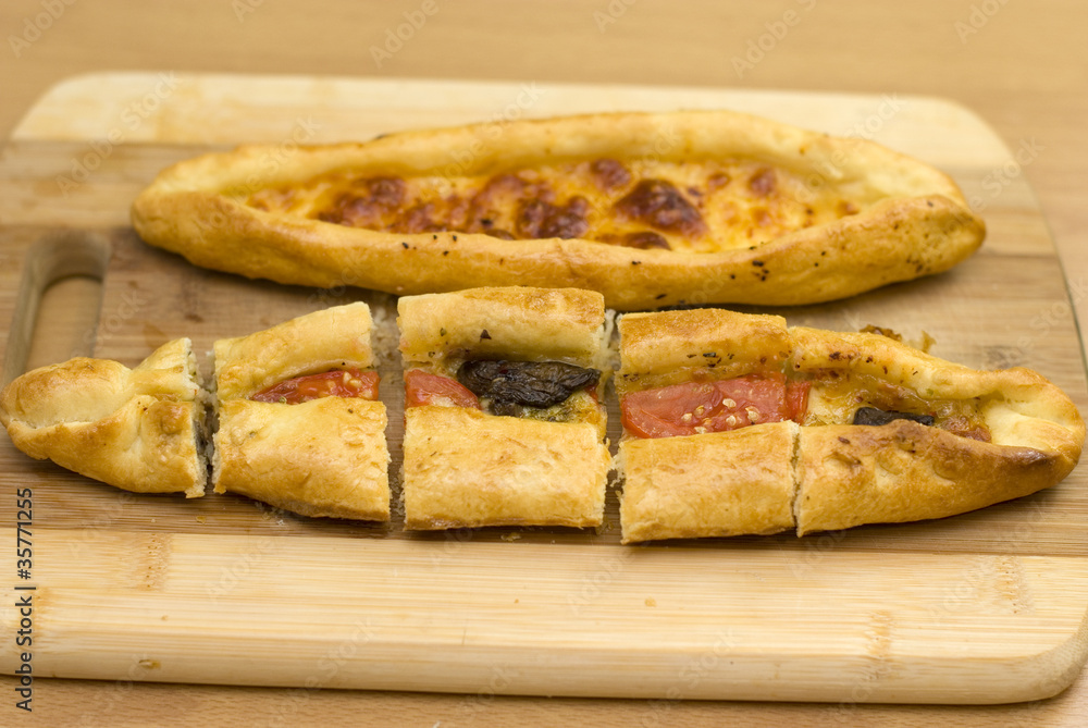 Turkish food pide, yeast dough cheese and butter. Turkish food pide, yeast dough cheese and butter.