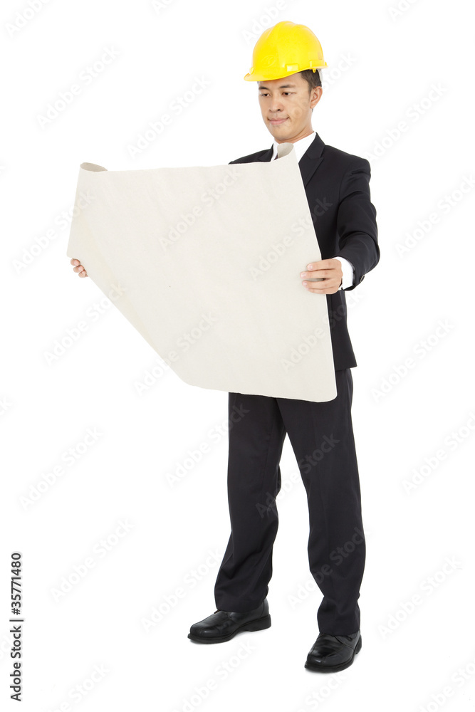 young architects holding a set of building plans young architects holding a set of building plans