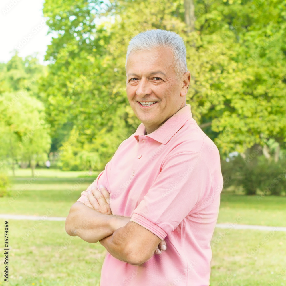 Portrait of smiling old man in the park Portrait of smiling old man in the park