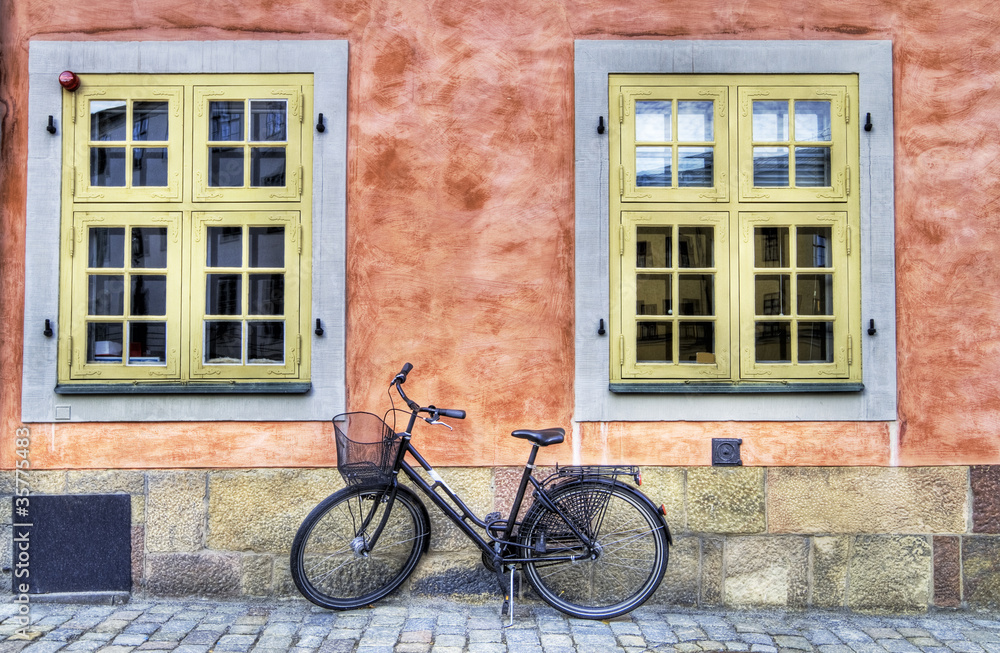 Old bicycle on a cobblestone street.