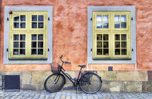Old bicycle on a cobblestone street. © Anette Andersen