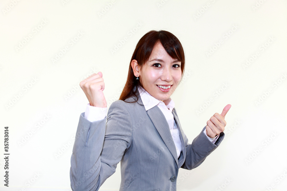 ガッツポーズで爽やかな笑顔のオフィスレディー ガッツポーズで爽やかな笑顔のオフィスレディー