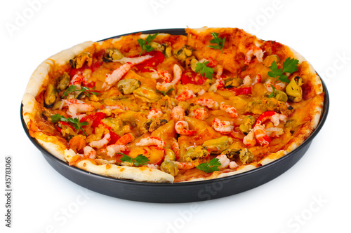 Delicious pizza with seafood on plate isolated on white