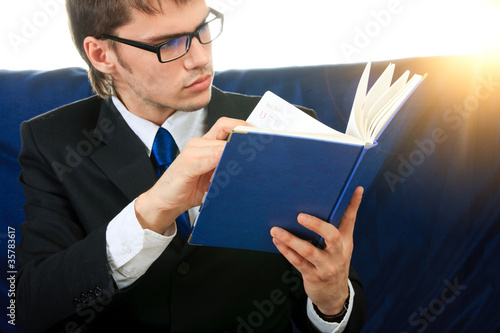 Businessman and notebook. Close up