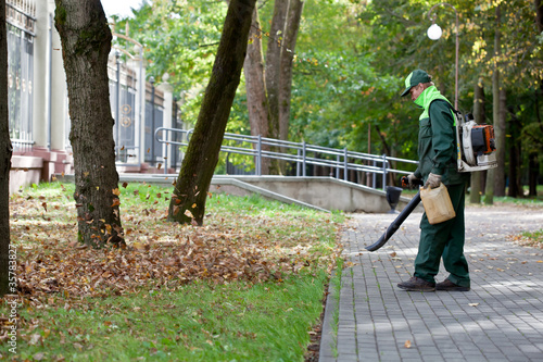 Landscaper operating gas Leaf Blower