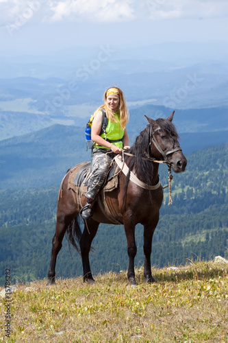 rider on horseback at mountains