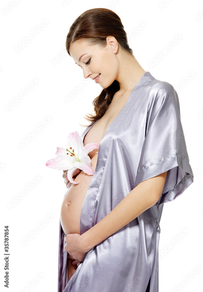 Pregnant woman holding flower isolated on white Pregnant woman holding flower isolated on white