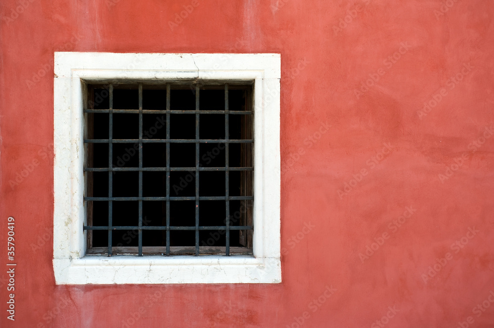 Window and red wall. Venice, Italy.