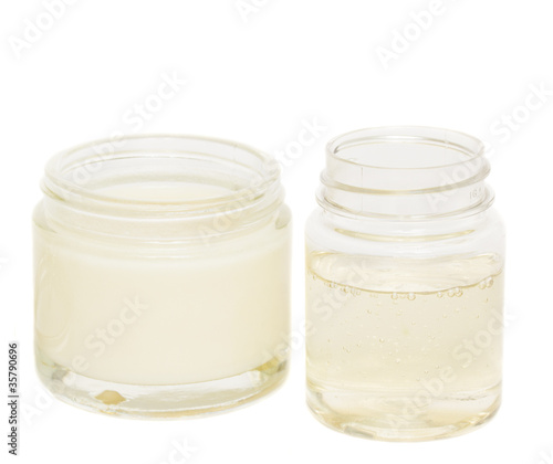 jars with cream and lotion isolated on white background