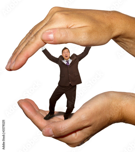 Businessman in the hand photo